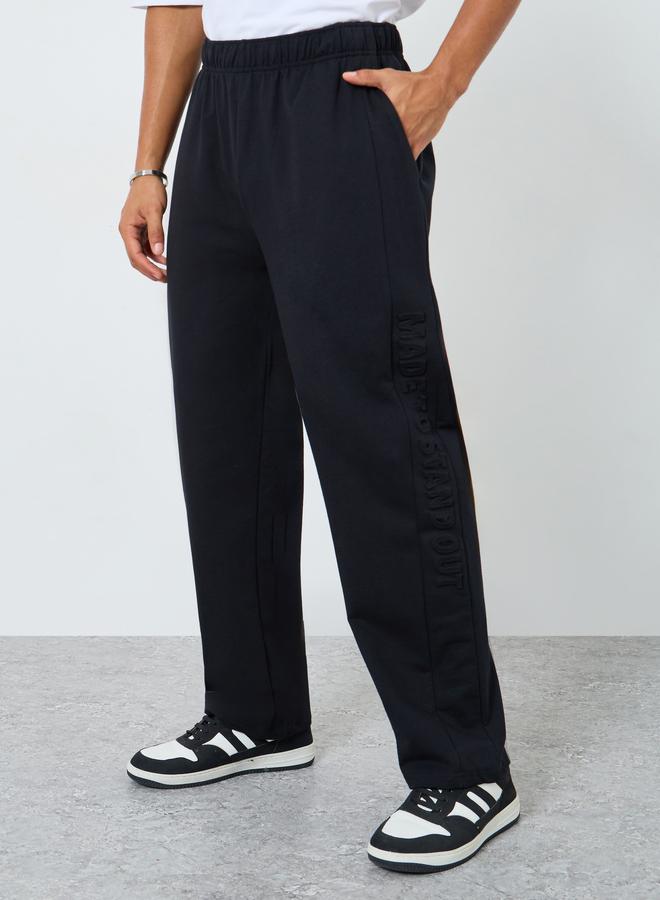 Styli Men Black Terry Joggers with Embossed Detail - Image 1