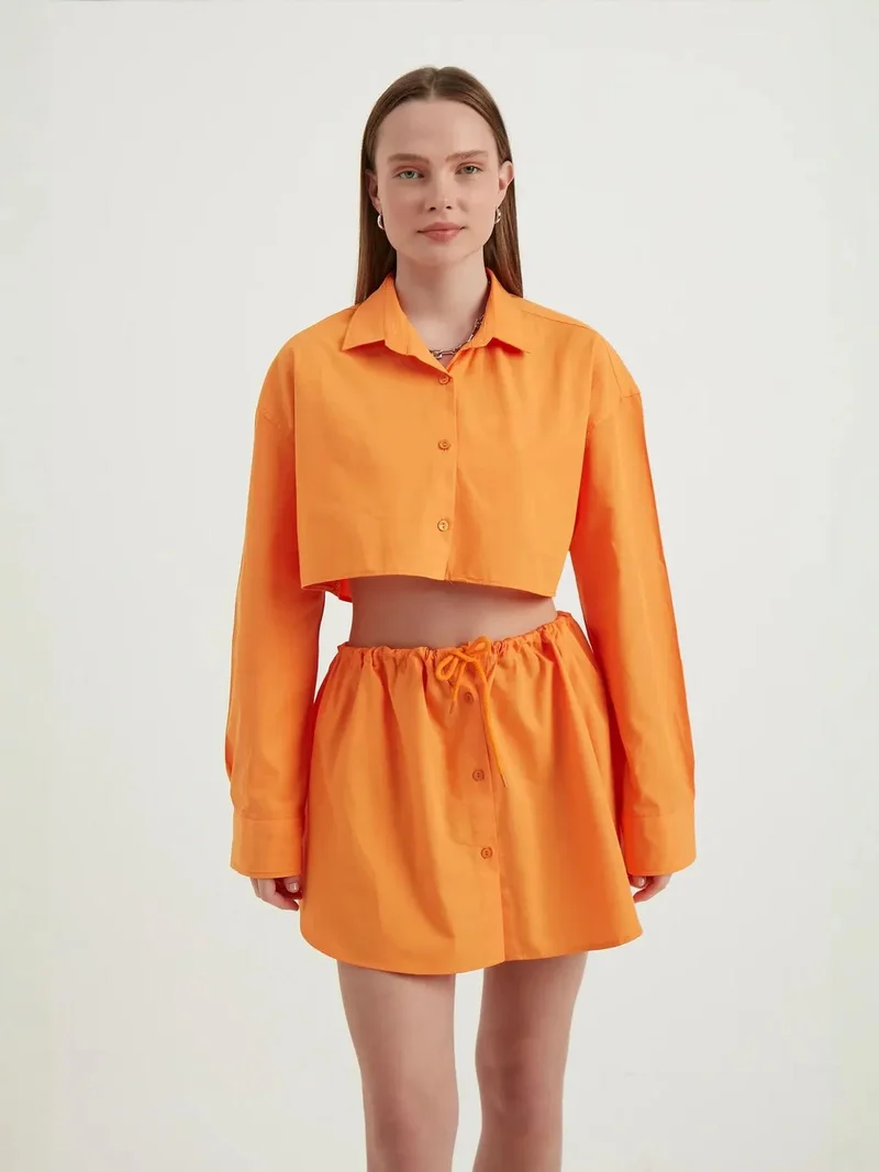 زوبعة قميص قصير فضفاض بأكمام واسعة