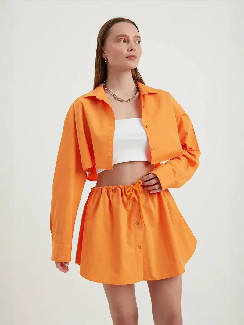 زوبعة قميص قصير فضفاض بأكمام واسعة