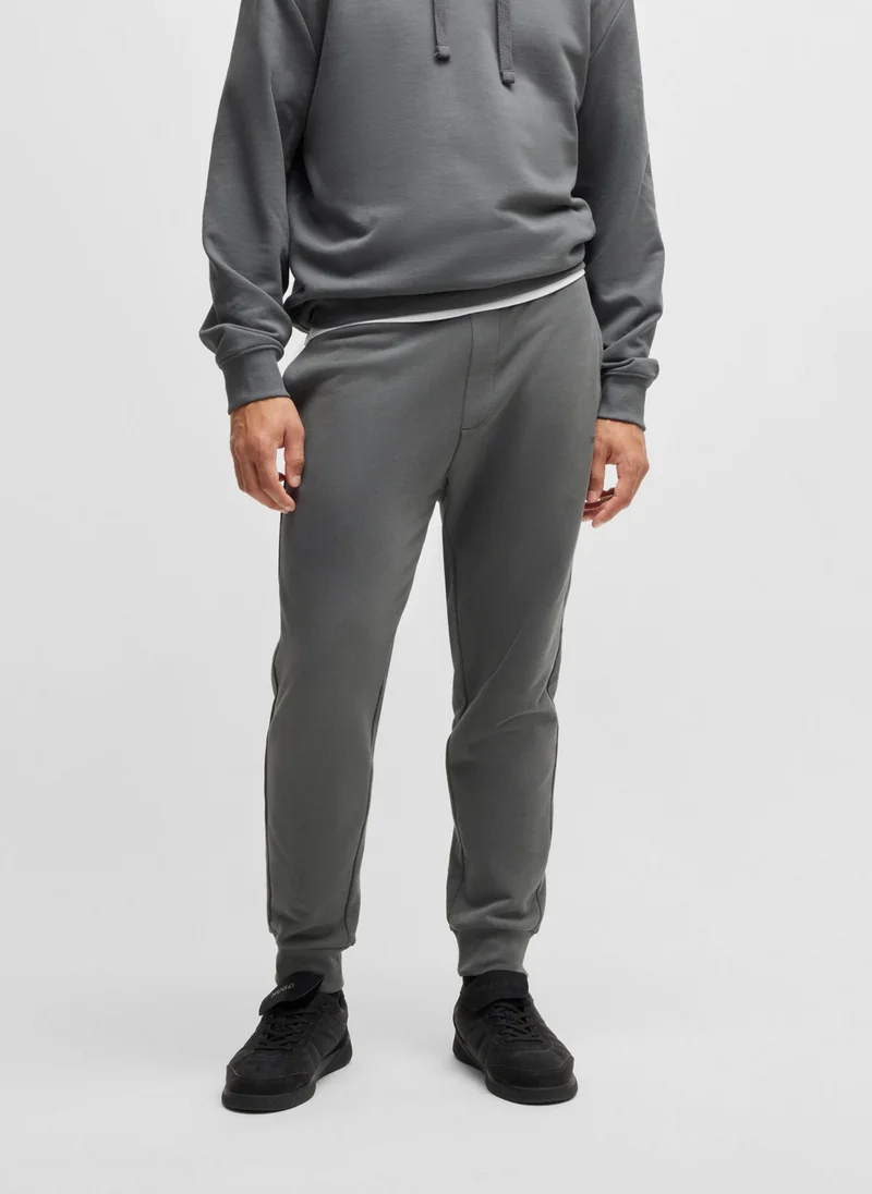 HUGO Cotton-terry tracksuit bottoms with logo print