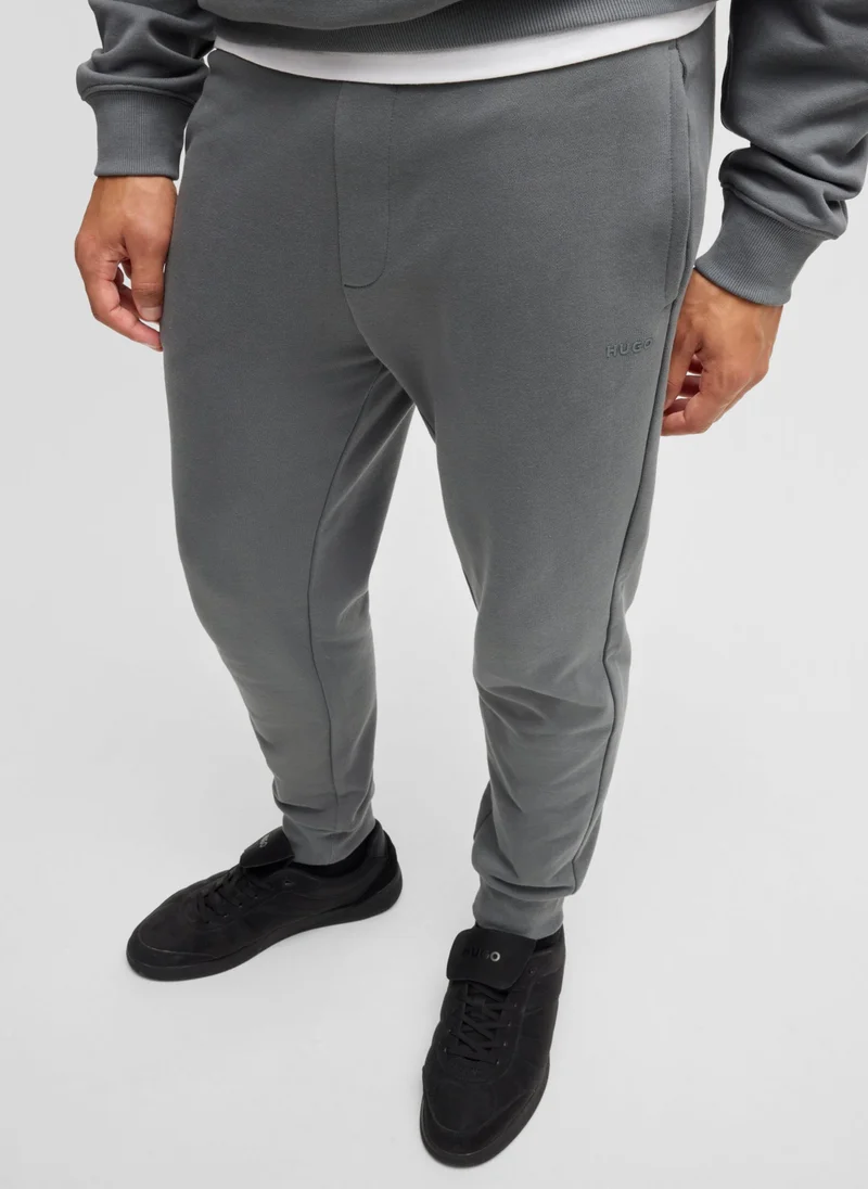 HUGO Cotton-terry tracksuit bottoms with logo print
