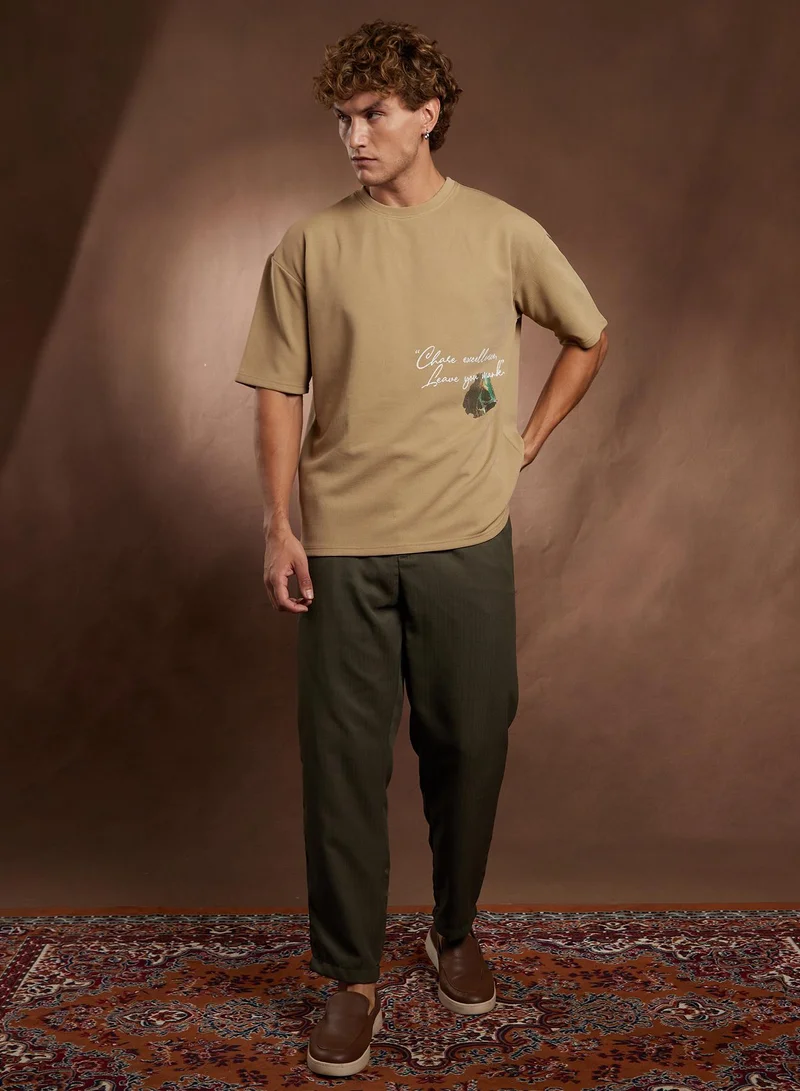 Campus Sutra Campus Sutra Men's Khaki Beige Boxy Grecian-Modernism T-Shirt For Casual Wear | Crew Neck | Short Regular Sleeves | Pull On Closure | T-Shirt Crafted With Comfort Fit For Everyday Wear