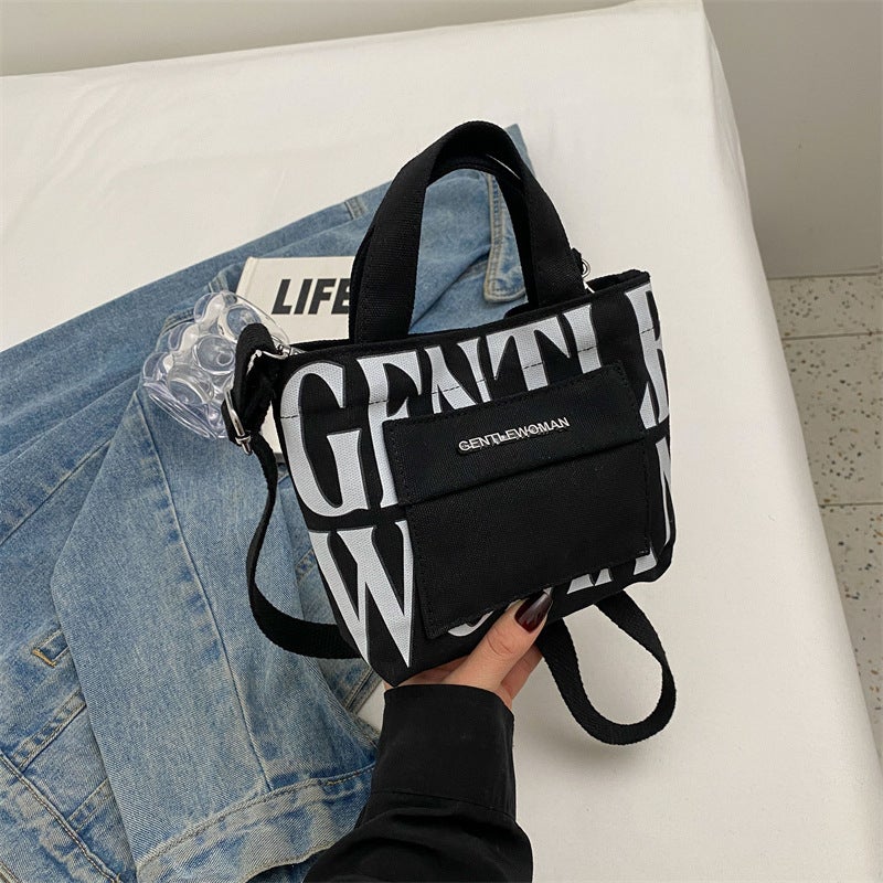 Thailand Gentle Woman Hardware Mini Letter Print Portable Canvas Bag Contrast Color Casual Shoulder Bag - Image 1
