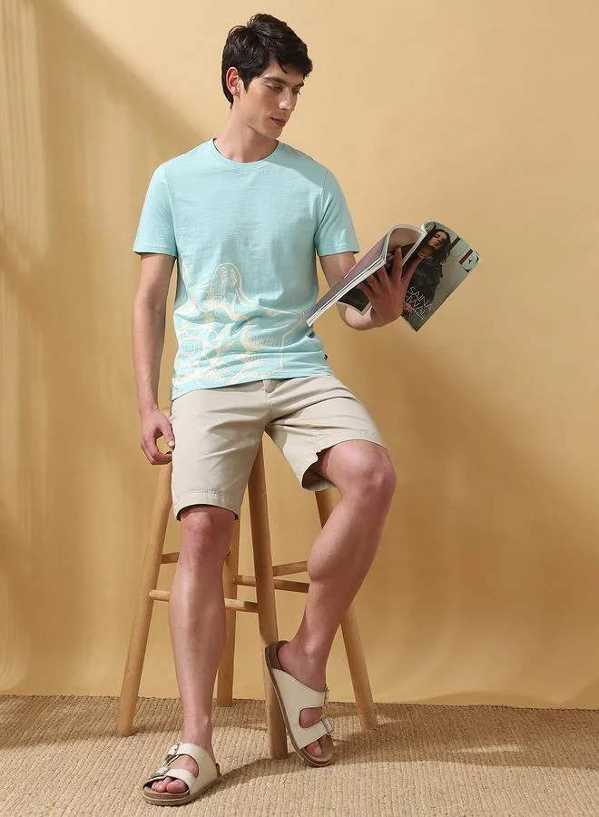 دينيس لينغو تيشيرت رجالي قطن 1% مطبوع مقاس عادي بلون أزرق بيضوي