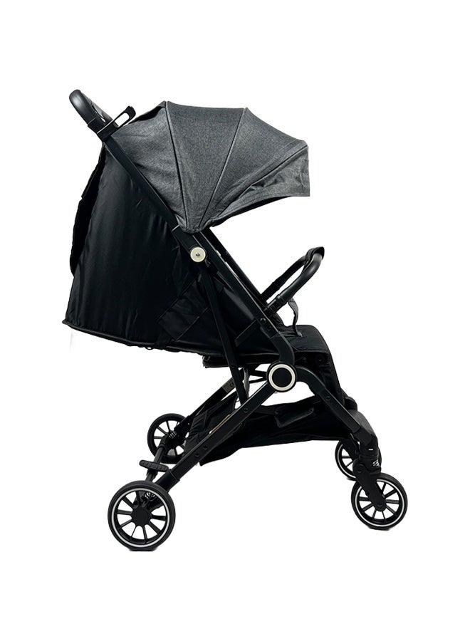 Foldable and lightweight baby stroller with flexible wheels and a protective canopy, dark gray color - Image 2