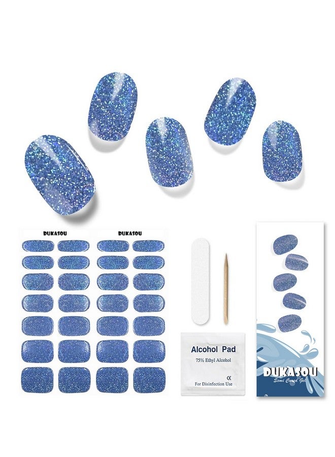دوكاسو شرائط أظافر جل شبه معالجة، 28 قطعة من شرائط أظافر جل لامعة زرقاء تحتاج إلى ضوء الأشعة فوق البنفسجية، ملصقات أظافر جل ولفائف أظافر كاملة للنساء والفتيات والأطفال، تتضمن وسادات تحضير ومبرد أظافر وعصا خشبية - Image 1