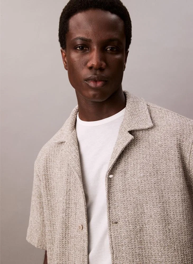 كالفن كلاين جينز بولو مطرز بتفاصيل مريحة