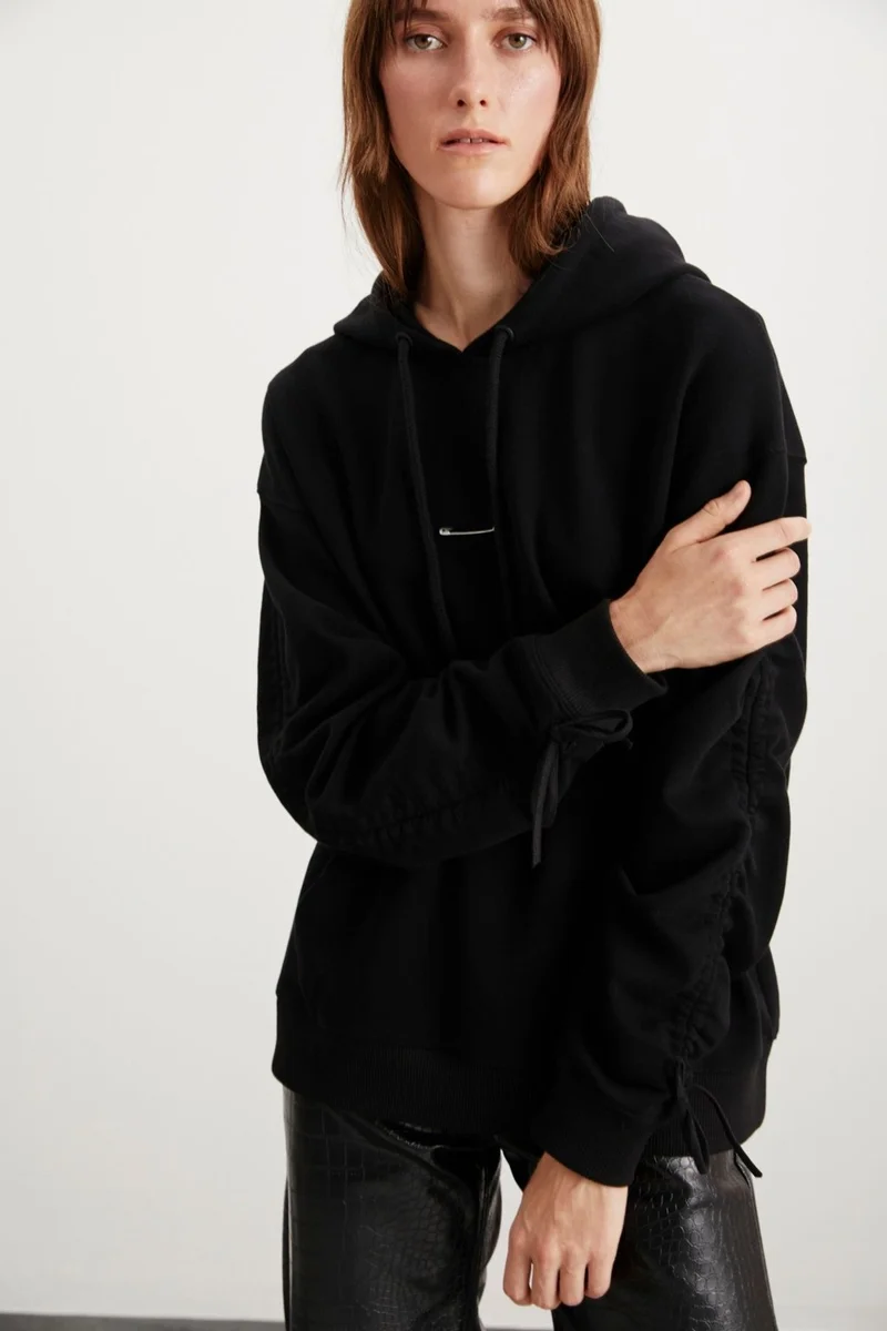 GRIMELANGE Meara Women's Hooded Sleeve Tie Detail Kangaroo Pocket Needle Detail Black Sweatshirt