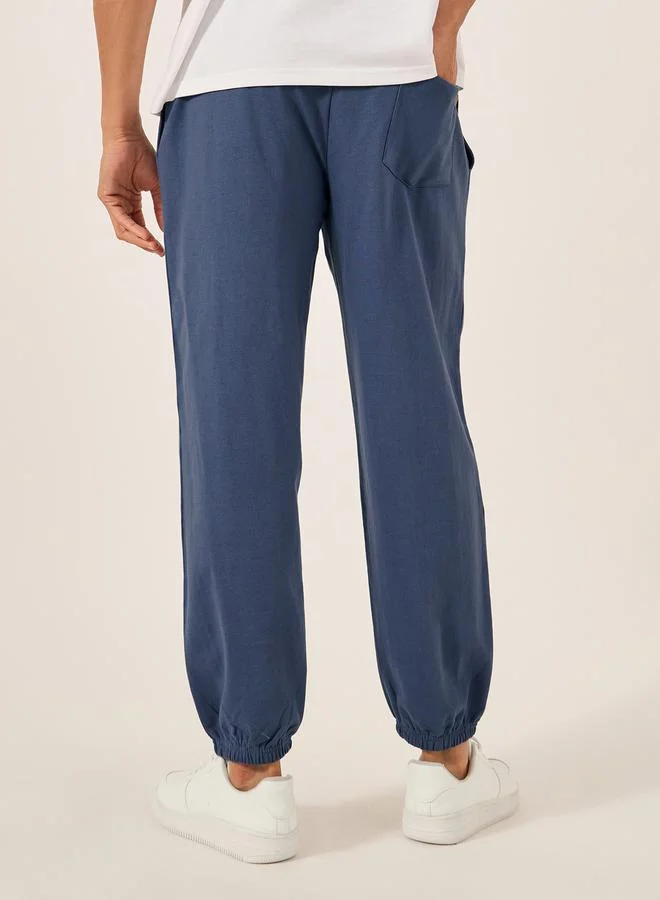 Styli Embroidered Slogan Mid Rise Relaxed Fit Joggers