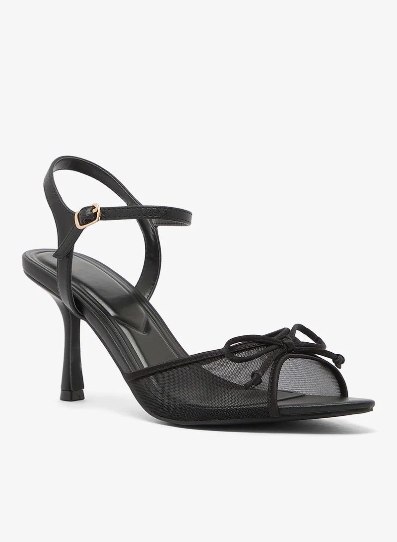 ترافل من نمشي صنادل بكعب متوسط بتفاصيل فيونكة من الشبك