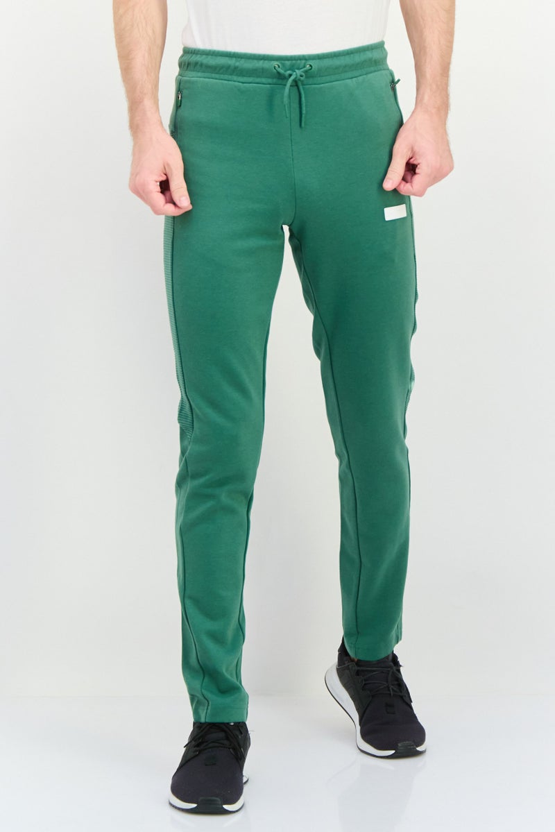 PUMA Men Sportswear Fit Outdoor Sweatpants,, Green - Image 1