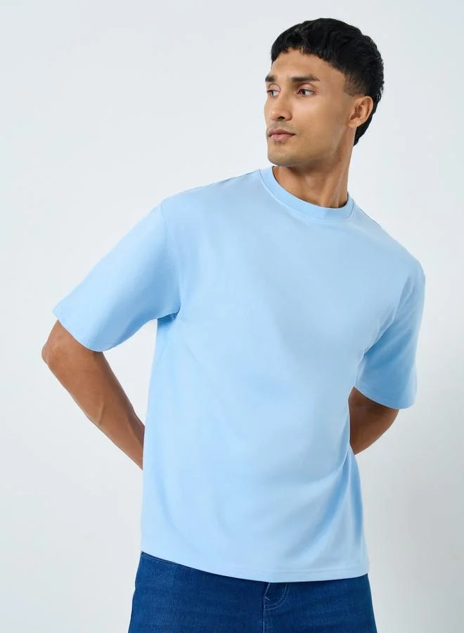 Styli Styli Men Graphic Print Interlock Oversized T-Shirt