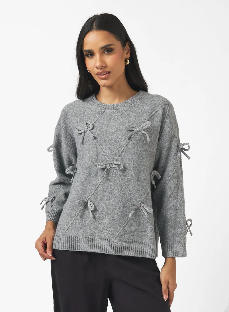 جينجر كنزة محبوكة بتفاصيل فيونكة