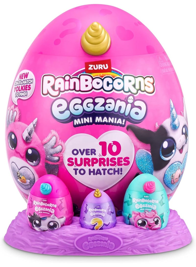 راينبوكورنز لعبة Rainbocorns Eggzania Surprise Mini Mania (السلسلة 1) - دمية قطيفة قابلة للجمع داخل بيضة مفاجآت، تتضمن ملصقات ومواد لصنع المجوهرات وسلايم؛ ألعاب للبنات من سن 3 سنوات فما فوق. - Image 1