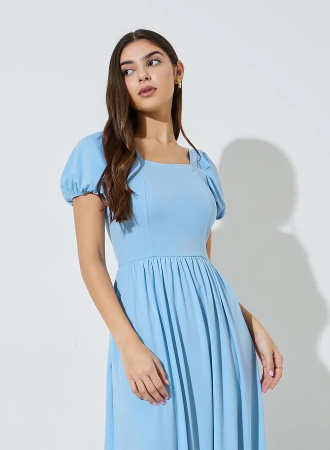 ستايلي Blue Solid Puff Sleeves Side Pocket Detail A-Line Maxi Dress