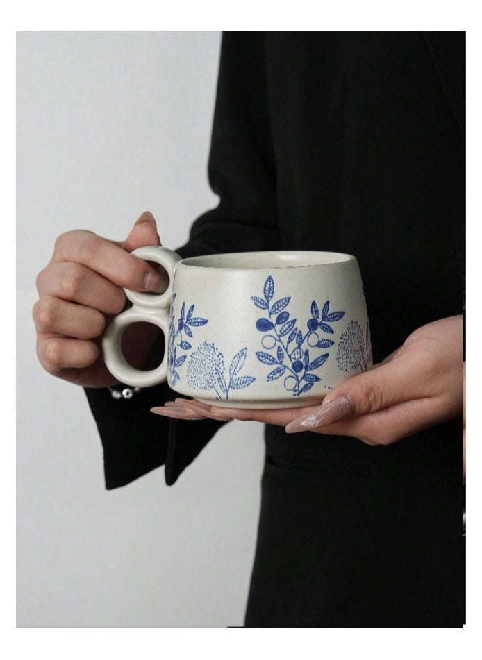 Qahwa White ceramic mug with elegant blue print and double handle provides exceptional comfort and modern elegance.  - Image 1