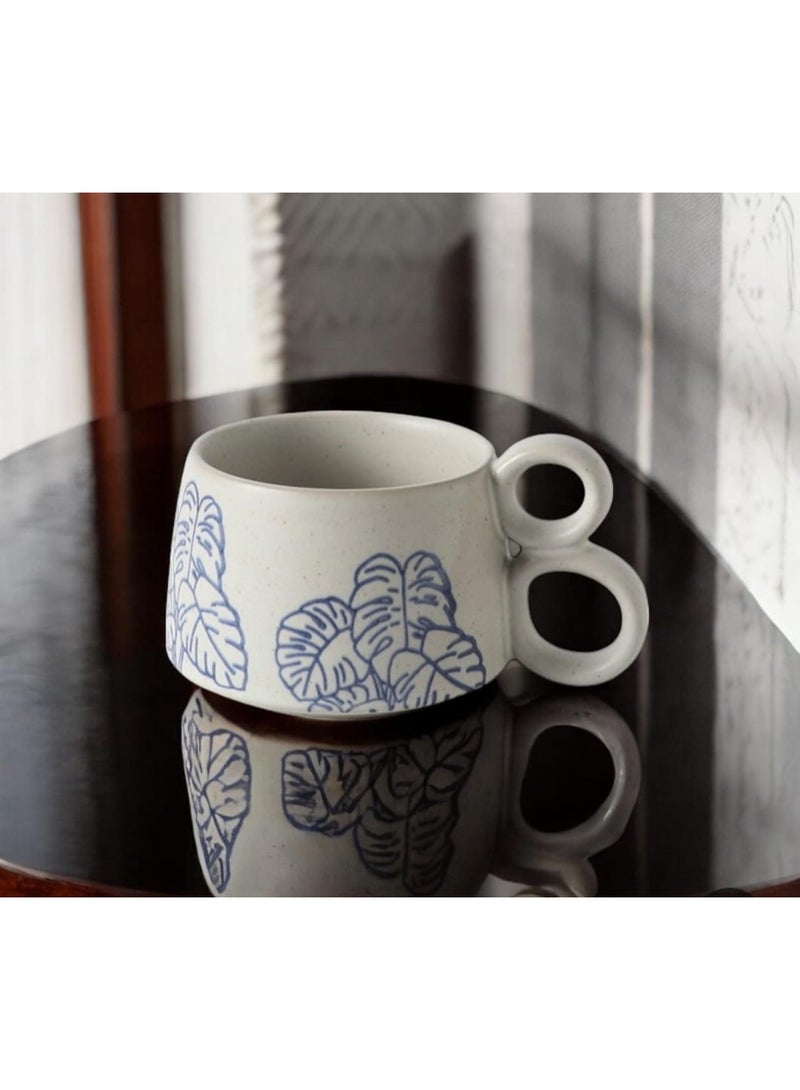 White ceramic mug with elegant blue print and double handle provides exceptional comfort and modern elegance. - Image 2