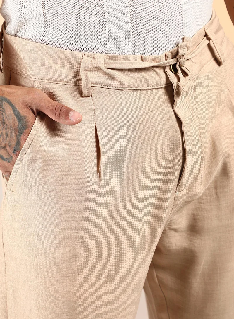 Campus Sutra Men's Saltbox Beige Solid Pleated Trousers