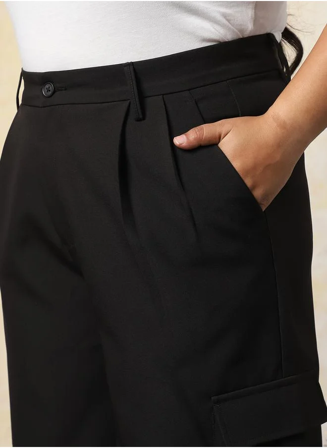 هاي ستار Women Trousers in Black featuring Wide Leg fit with a solid pattern, regular length, secured with button closure, crafted from 95% polyester 5% spandex – your go-to choice for effortless elegance.