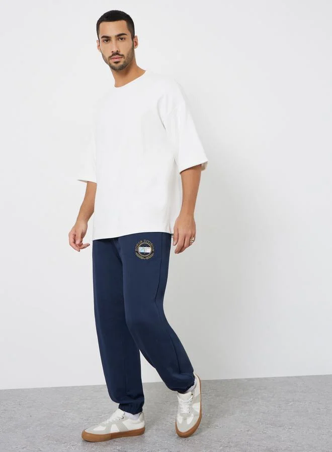 Styli Men Navy Blue Embroidered Terry Joggers