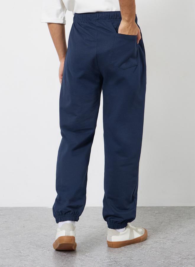 Styli Men Navy Blue Embroidered Terry Joggers - Image 4