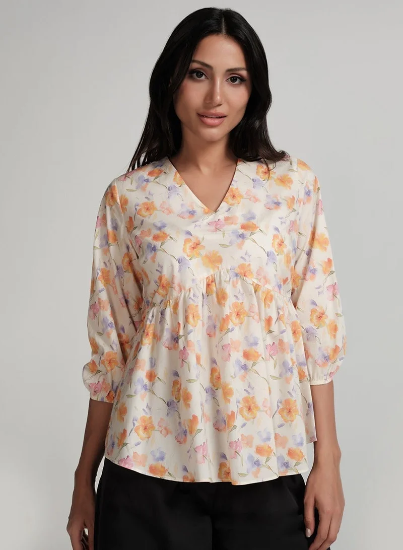 زجزاج بلوزة بأكمام مطاطية وياقة على شكل حرف