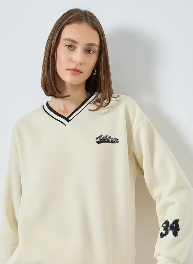 Styli Women Off White Varsity Sweatshirt