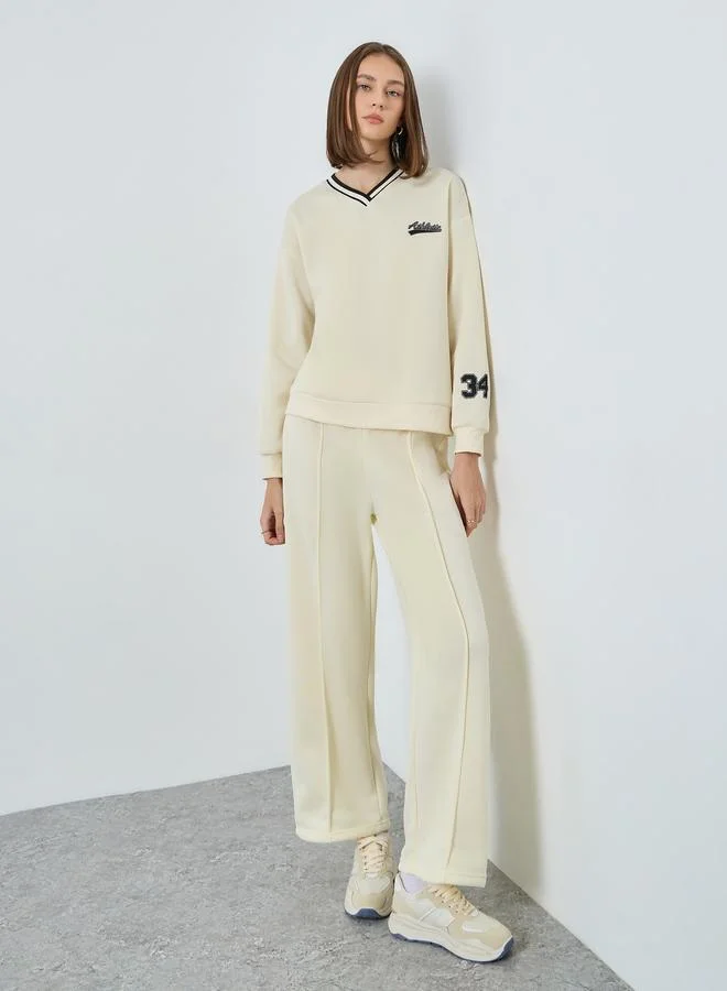 Styli Women Off White Varsity Sweatshirt