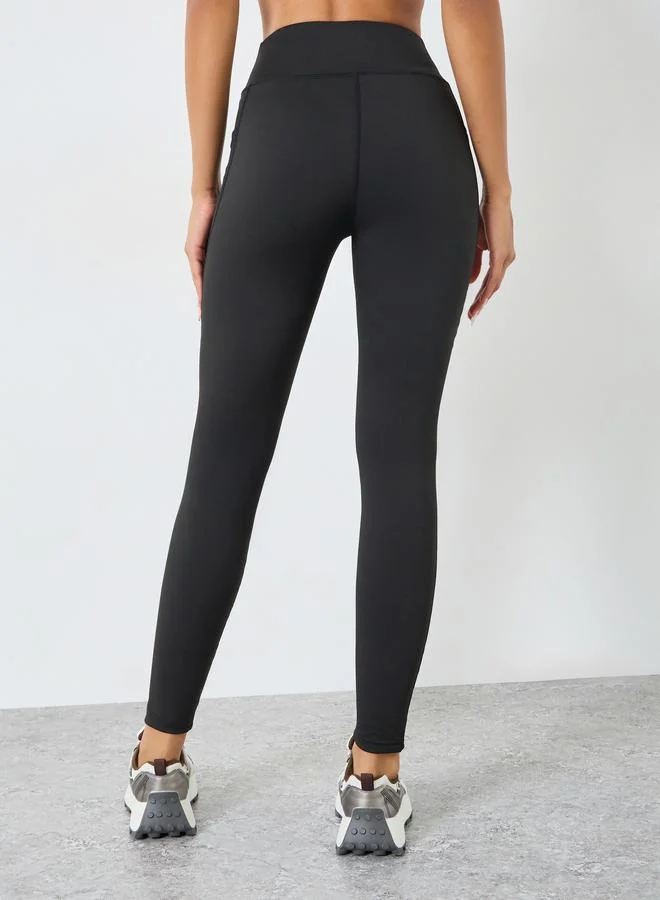 Styli Active Black Women Black Solid Leggings with Mesh Pocket for Women | Best Price UAE