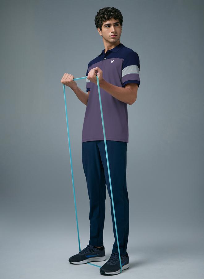 تكنوسبورت بولو بيكيه بقصة ضيقة ونمط كتل الالوان - Image 5