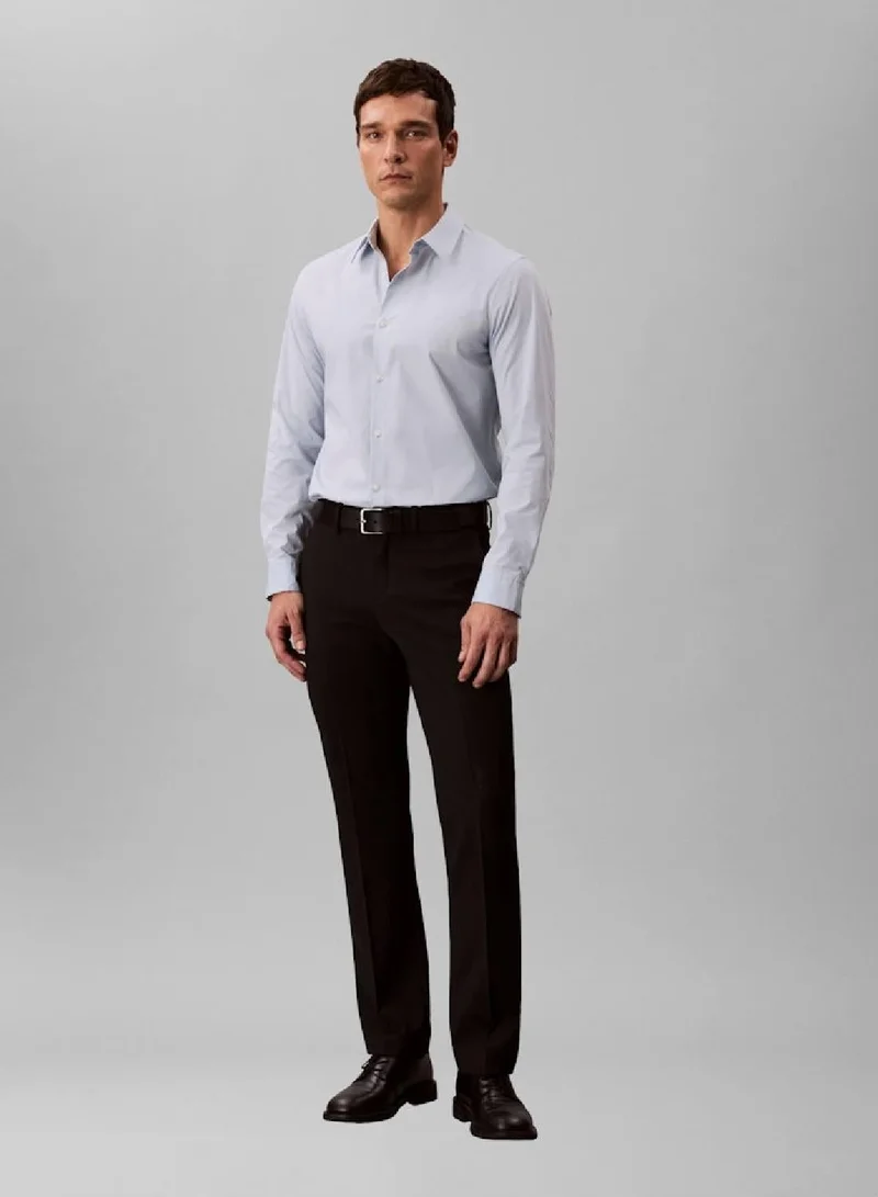 كالفن كلاين قميص مرن بقصّة سليم بأزرار