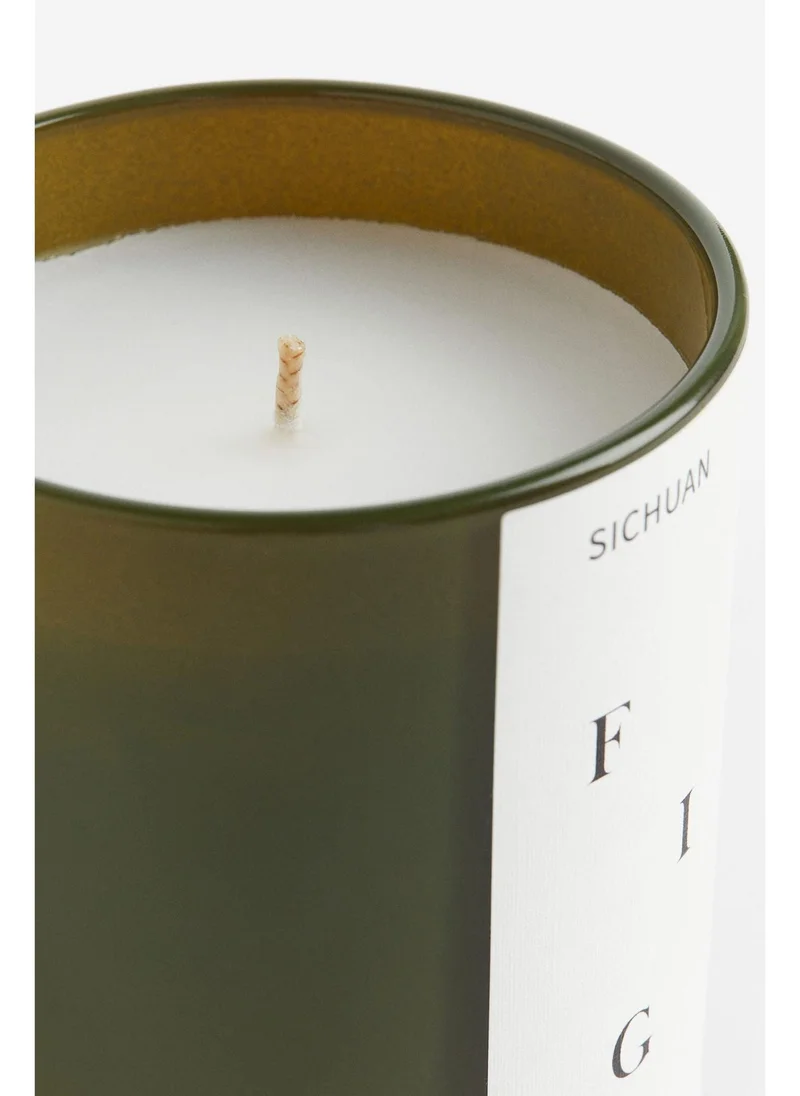 اتش اند ام Scented candle in a glass holder