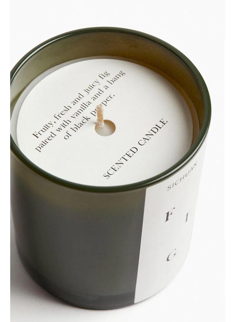 اتش اند ام Scented candle in a glass holder