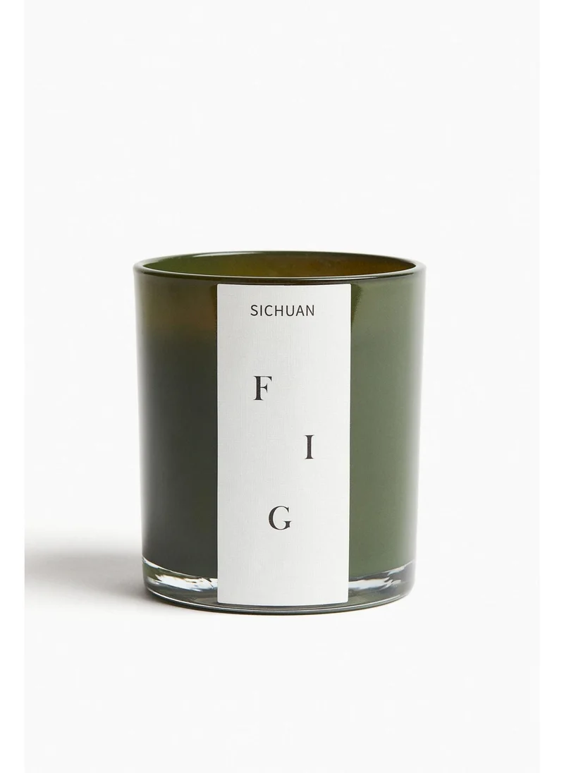 اتش اند ام Scented candle in a glass holder