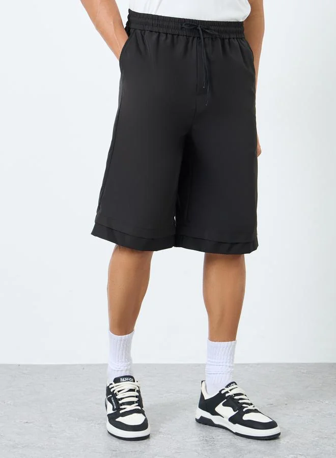 ستايلي Styli Men Black Oversized Solid Shorts with Drawstring