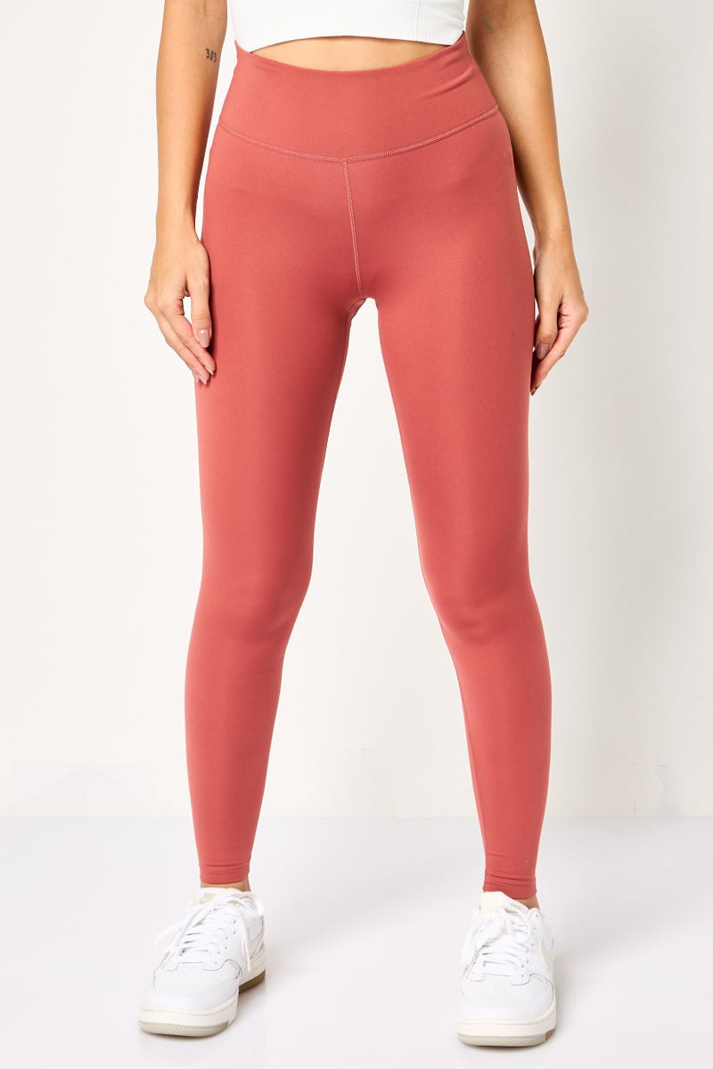 Nike Women Tight Fit Brand Logo Training Leggings, Rust - Image 1