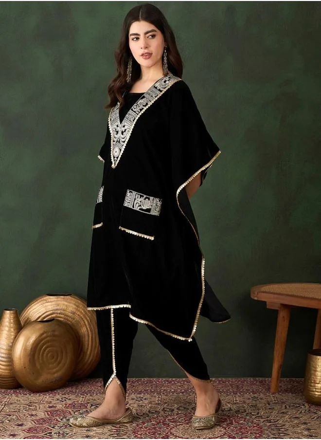 ISHIN Elastic Women Black Velvet Kurta Set with Embroidered pattern Tunic and Palazzo features a Round neckline and Three-Fourth Sleeve secured with Elastic closure and styled in Straight Fit ideal for Festive moments — designed to make heads turn.