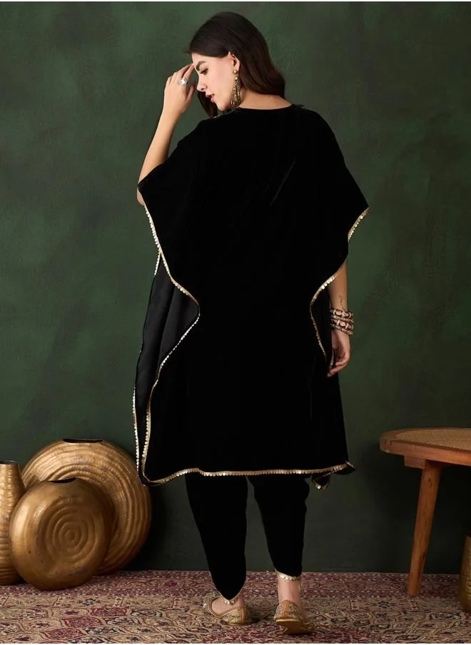 ISHIN Elastic Women Black Velvet Kurta Set with Embroidered pattern Tunic and Palazzo features a Round neckline and Three-Fourth Sleeve secured with Elastic closure and styled in Straight Fit ideal for Festive moments — designed to make heads turn.