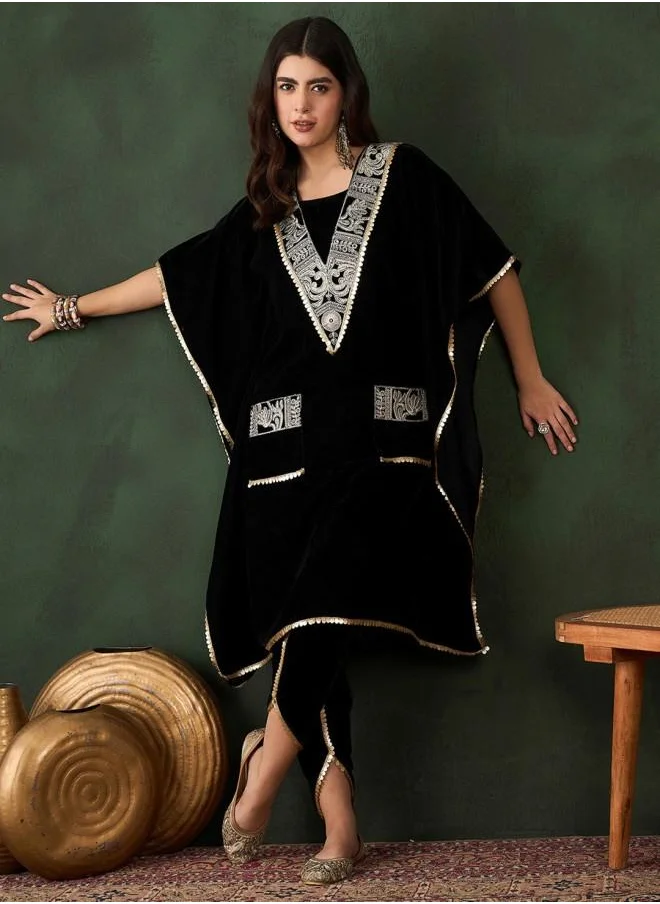 آي شين Elastic Women Black Velvet Kurta Set with Embroidered pattern Tunic and Palazzo features a Round neckline and Three-Fourth Sleeve secured with Elastic closure and styled in Straight Fit ideal for Festive moments — designed to make heads turn.