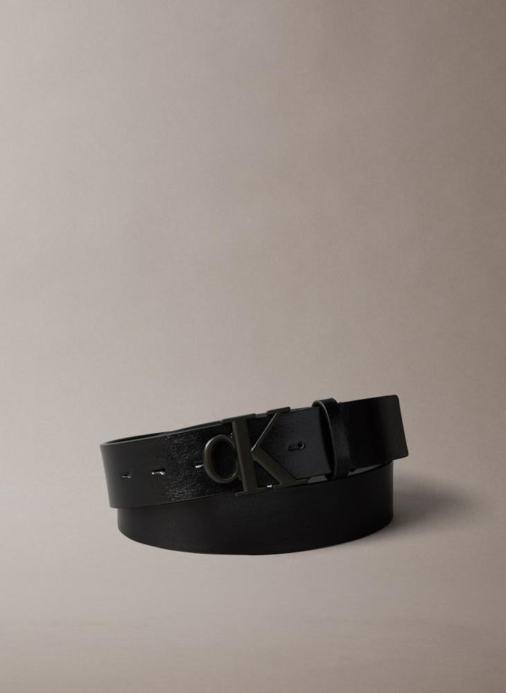A belt with custom openings and a logo buckle