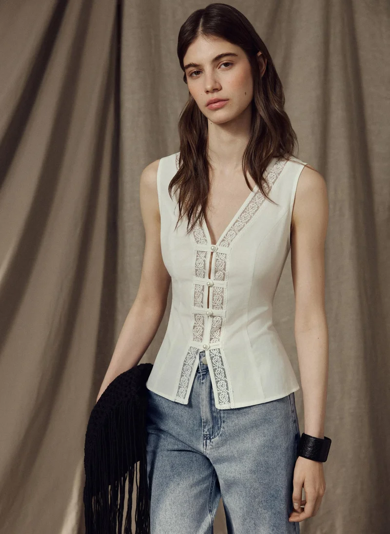 Lichi  Top with lace detailing and pearlescent buttons for Women | Best Price UAE