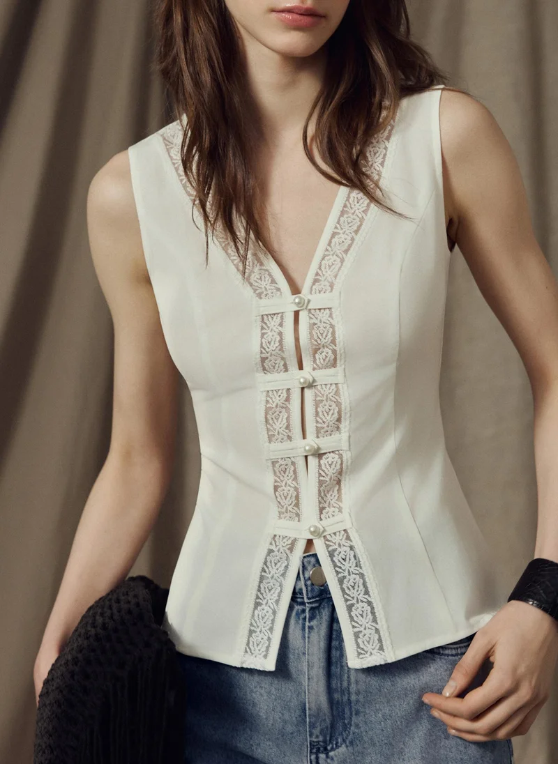 Top with lace detailing and pearlescent buttons