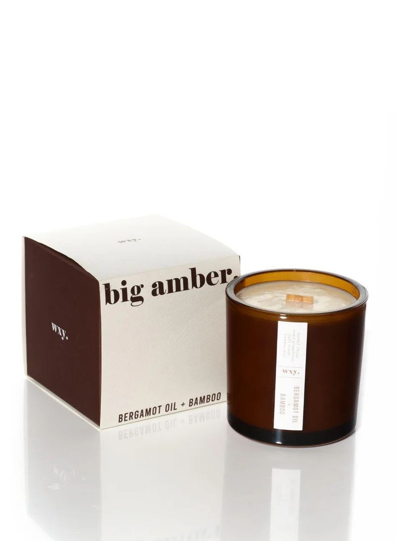 دبليو اكس واي شمعة  معطرة آمبر برائحة زيت البرغموت والخيزران