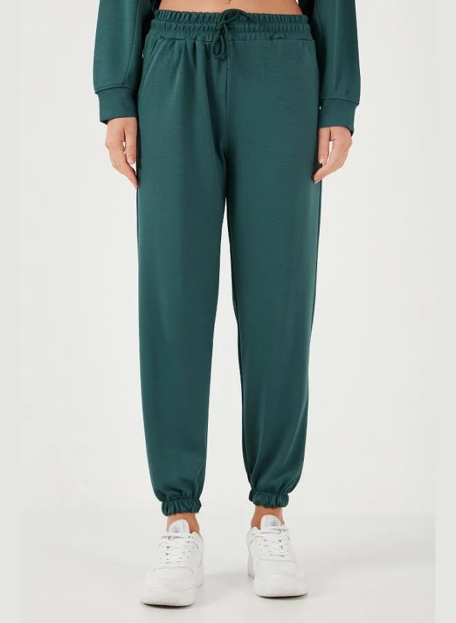 ليلا سروال رياضي نسائي من أويشو بقصة عادية من قماش ليلى مطاطي