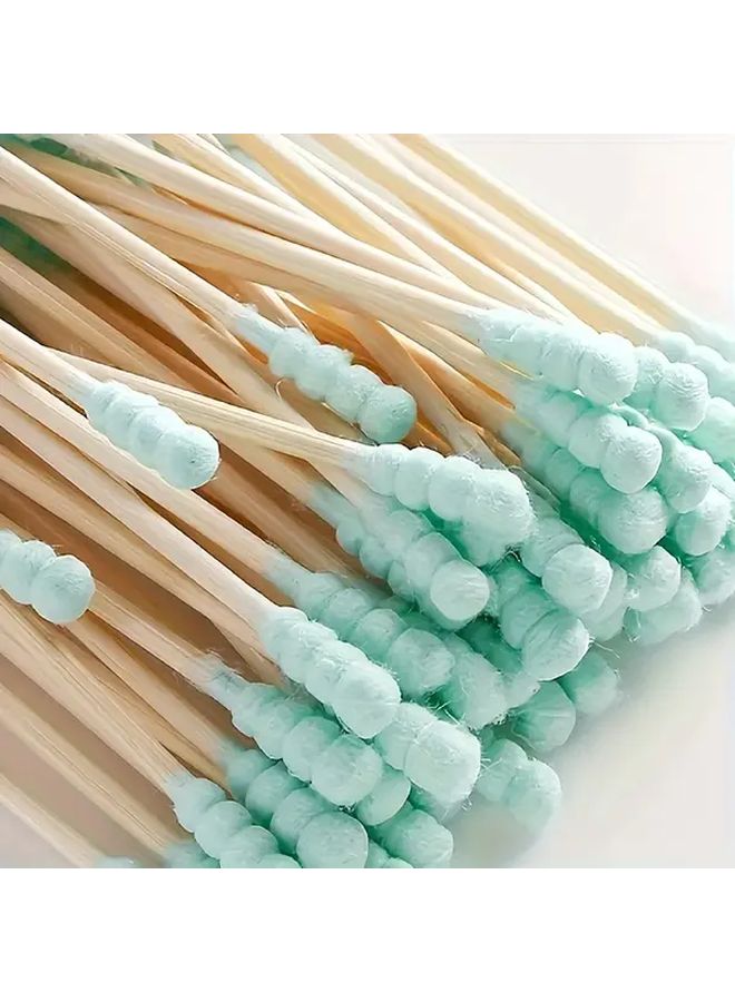 100 قطعة من أعواد القطن الحلزونية المزدوجة باللون الأخضر لمكياج والعناية بالأذن والاظافر - Image 1