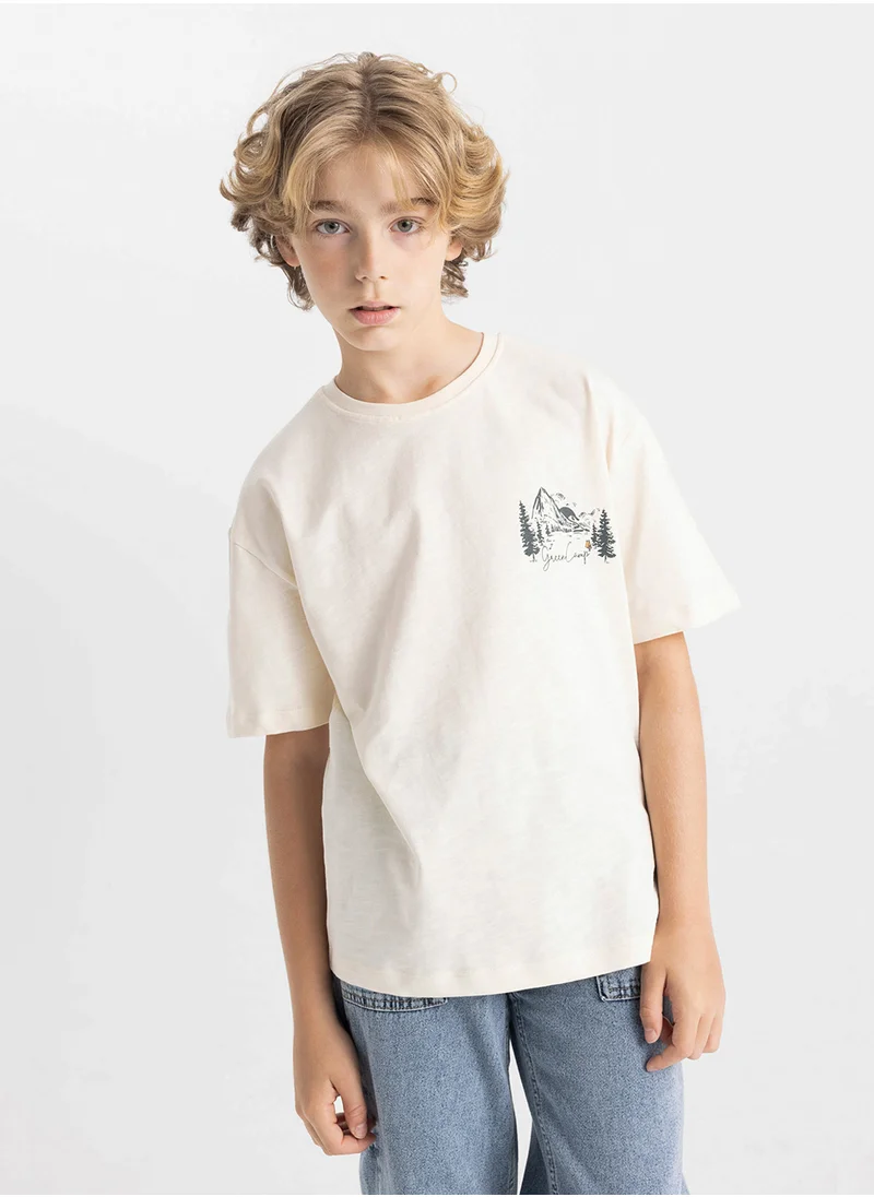 ديفاكتو Oversized Fit Crew Neck Printed Short Sleeve T-Shirt