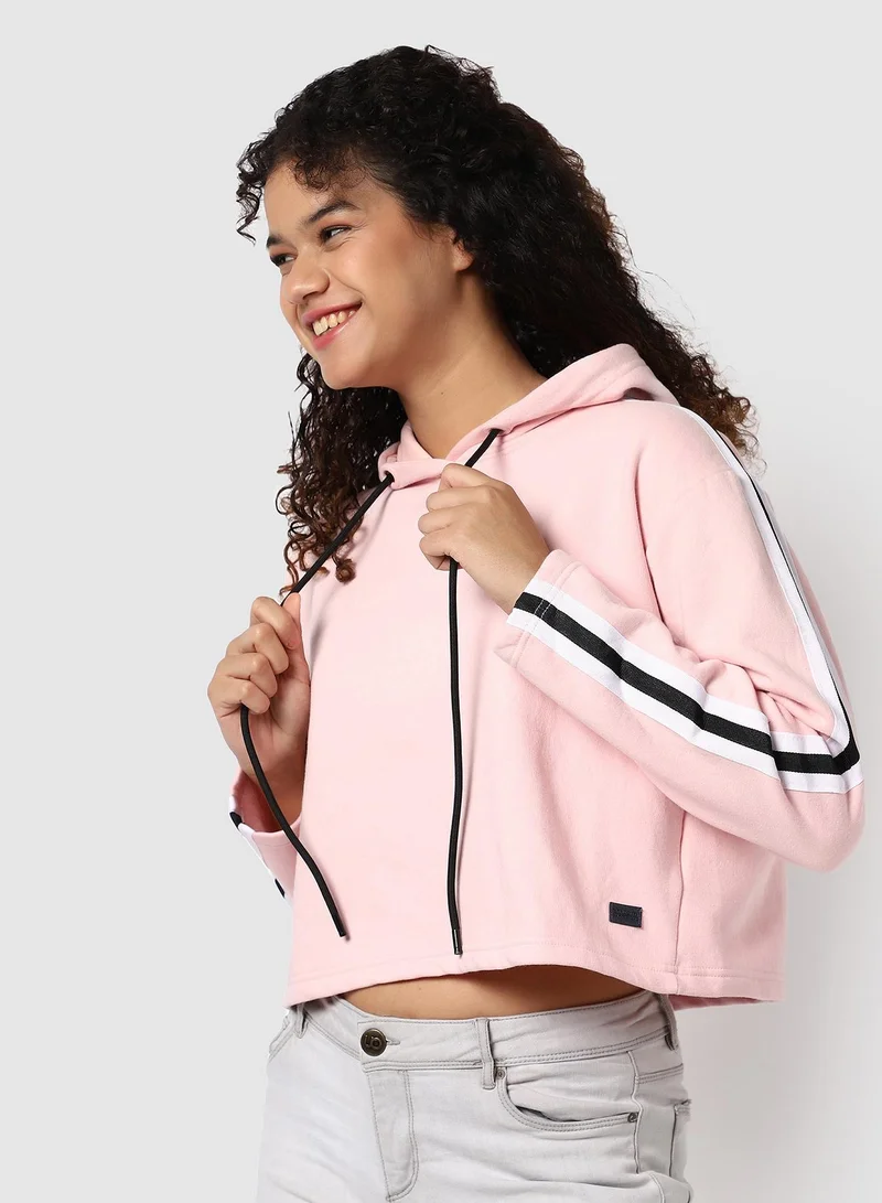 Campus Sutra Women's Pink Cropped Hoodie With Contrast Striped Sleeve For Casual Wear | Hood Neck | Long Sleeve | Drawstring Closure | Cotton Sweatshirt Crafted With Comfort Fit For Everyday Wear