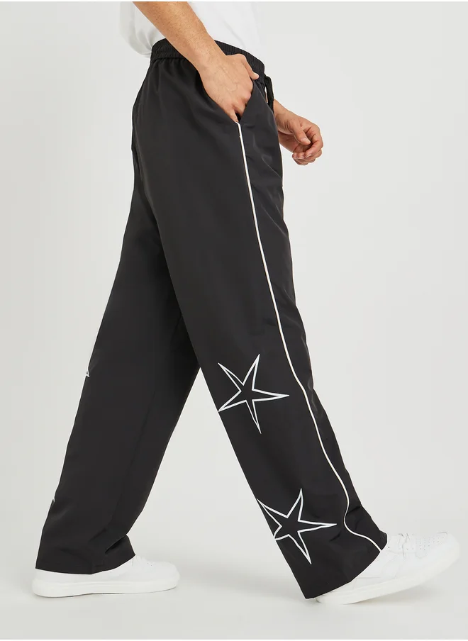 ستايلي Styli Star Printed Oversized Open Hem Joggers with Piping Detail