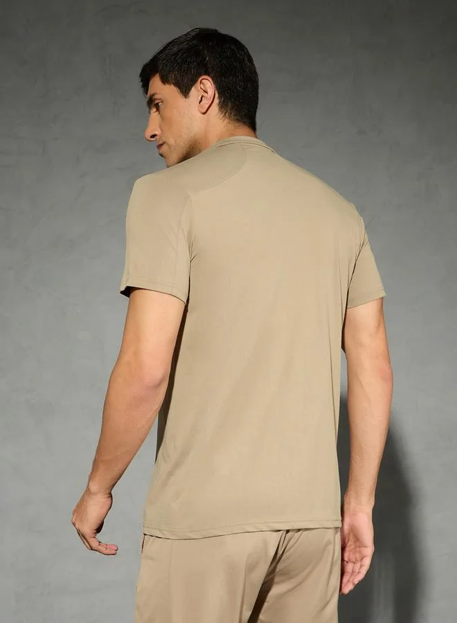 تكنوسبورت تيشيرت بولو تكنوسبورت بأكمام قصيرة مطاطية بلون سادة