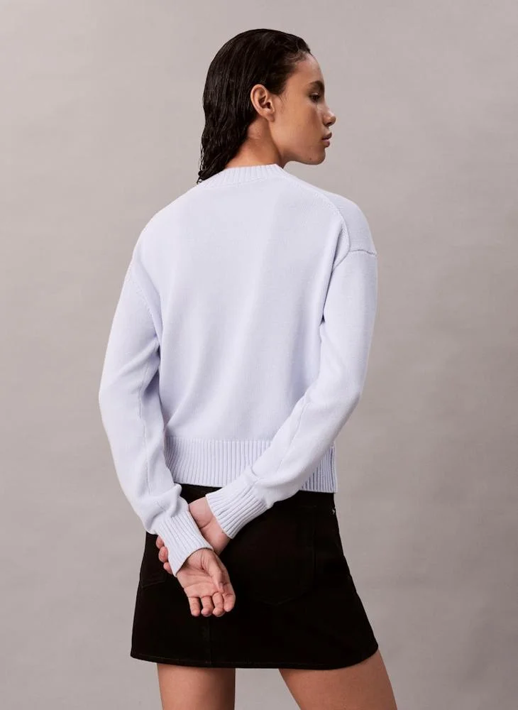 كالفن كلاين جينز كنزة برقبة دائرية ومزينة بالشعار